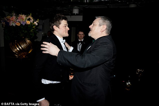 Robert Aramayo has jumped to the defence of Tourette's campaigner John Davidson who left the BAFTAs on Sunday after shouting racial slurs in the audience (pictured together