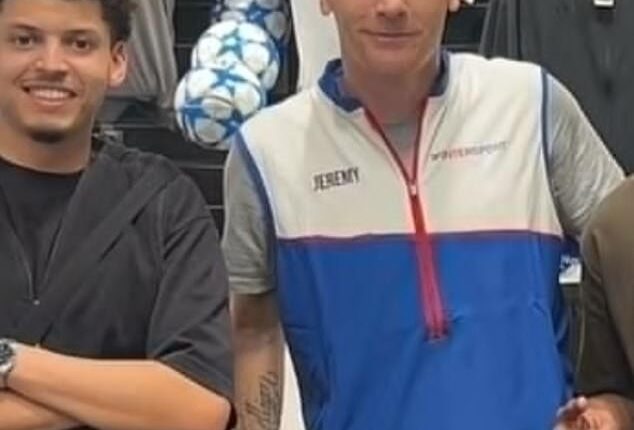 Former Barcelona defender Jeremy Mathieu (centre) now works as a shop assistant in France