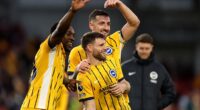 Brighton celebrated James Milner's record-breaking day with three points against Brentford at the Gtech Community Stadium