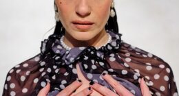 Bridgerton star Genevieve Chenneour went braless in a daring sheer poncho as she attends the Poet-Lab show during London Fashion Week on Friday