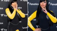 Cardi B takes a tumble while giving a robot a lap dance