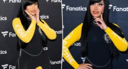 Cardi B takes a tumble while giving a robot a lap dance