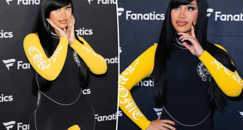 Cardi B takes a tumble while giving a robot a lap dance