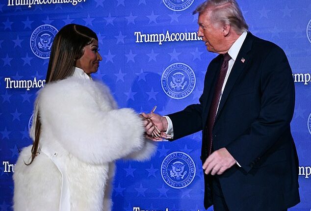President Donald Trump and rapper Nicki Minaj embraced hands when she came on stage for quick remarks at a Trump Accounts event