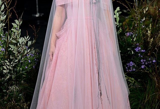 Charli XCX turned heads in a dramatic bridal style gown as she attended the Wuthering Heights UK premiere in London on Thursday