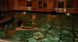 Former US President Bill Clinton swims in a pool in this image released by the Department of Justice in Washington