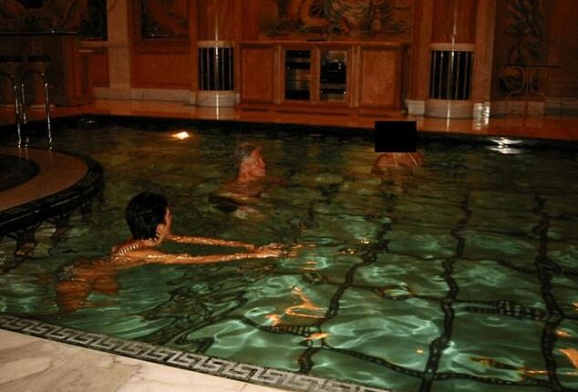 Former US President Bill Clinton swims in a pool in this image released by the Department of Justice in Washington