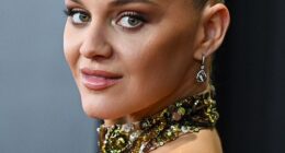 Kelsea Ballerini's elaborate updo was pulled so tight away from her face during Sunday night's Grammy Awards that she had to take ibuprofen for the pain