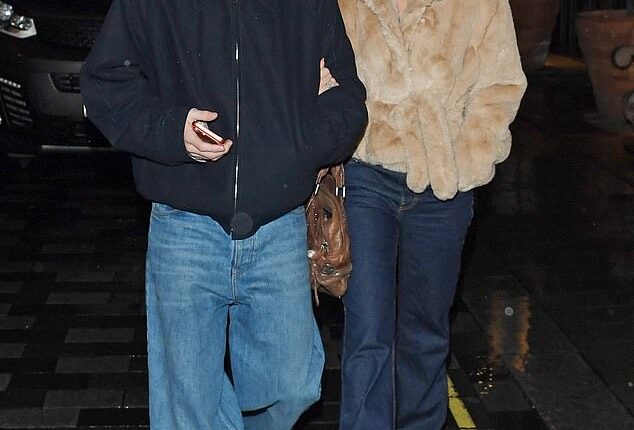 Cruz Beckham and girlfriend Jackie Apostel were arm-in-arm on Wednesday evening as they attended an exclusive screening of Sir Paul McCartney's new documentary, Man on the Run