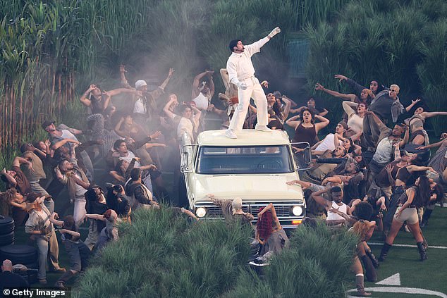 X users have faced a blackout as the social media app crashed during Bad Bunny's halftime show at the Super Bowl. The Puerto Rican rapper is shown performing at the show