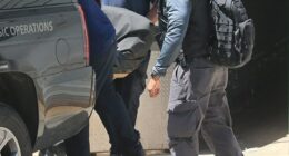 Prison guards are alleged to have used a decoy body to distract reporters gathered outside the jail as Epstein’s body was transferred to the Office of the Chief Medical Examiner. This image shows his body being removed from a Lower Manhattan hospital, where he was pronounced dead