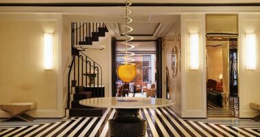 The Mark Hotel's beautiful yet timeless lobby decorated with the iconic black and white striped floors
