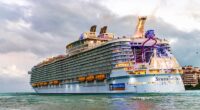 Five men were arrested in Miami last week after trying to board the Royal Caribbean Symphony of the Seas (pictured) for a cruise marketed as 'The World’s Biggest Gay Festival at Sea'