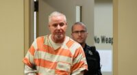 The trial of Colin Gray, a Georgia father accused of gifting his son a rifle before a school shooting in 2024, began on Monday. Colin is pictured entering a courtroom at an earlier date