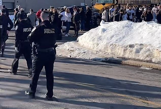 The scene outside of Dennis M Lynch Arena in Pawtucket, Rhode Island, after a gunman opened fire during a high school hockey tournament on Monday afternoon. At least one person, a young girl, has died in the gunfire, and four others are in hospital