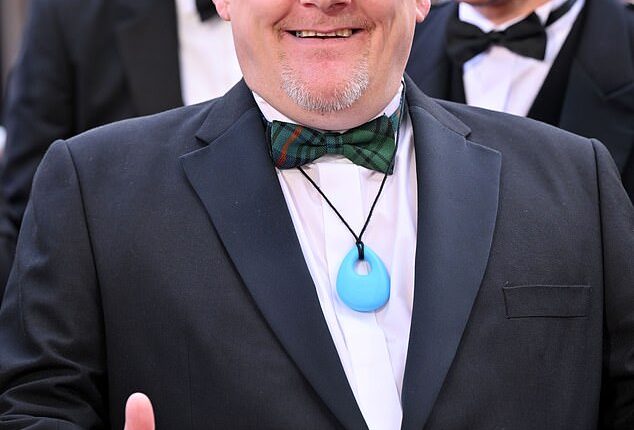 John Davidson is pictured here arriving at the BAFTA British Academy Film Awards at London's Royal Festival Hall on the evening of Sunday 22 February 2026