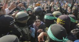 Arbel Yehoud being escorted by Hamas and Islamic Jihad fighters as she is handed over to the Red Cross in Khan Younis, southern Gaza Strip, January 30, 2025