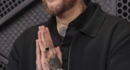 Jelly Roll pictured cozying up to Kristi Noem in resurfaced snaps... just days after singer avoided talking about ICE