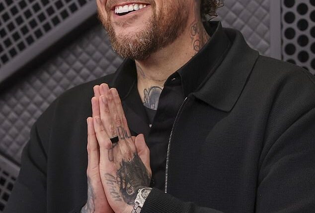 Jelly Roll pictured cozying up to Kristi Noem in resurfaced snaps... just days after singer avoided talking about ICE