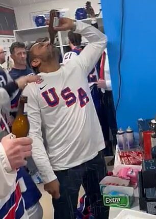 Kash Patel chugs a beer in the locker room of the men's hockey team at the Italy Olympics