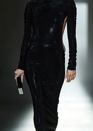 Supermodel Kate Moss, 52, looked incredible in a backless dress which featured a cheeky thong detail as she stormed the runway at the Gucci show in Milan on Friday