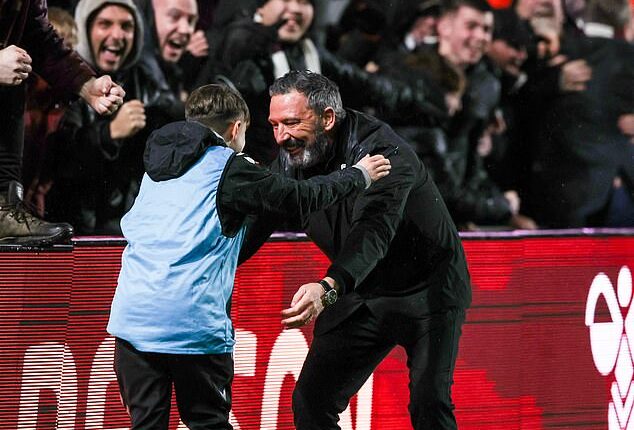 McInnes celebrated Tuesday's dramatic Edinburgh derby winner with a delighted ball boy