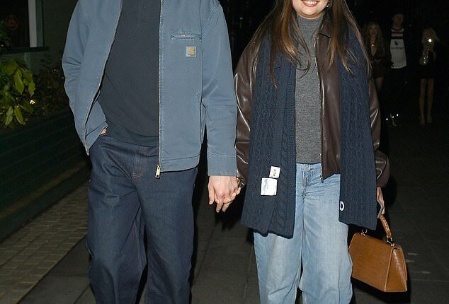 Man United keeper Senne Lammens posed outside The Ivy in Manchester with his girlfriend