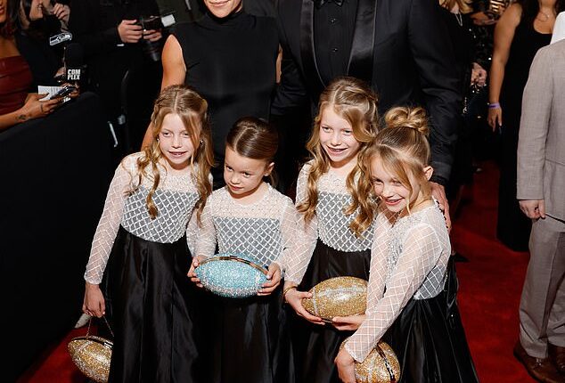 The Rams' Matthew Stafford arrives at the NFL honors with his family before winning MVP