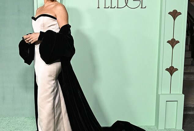 Meghan Markle went solo, donning a pink strapless dress with an enormous velvet black train at the annual Fifteen Percent Pledge Fundraising Gala last night