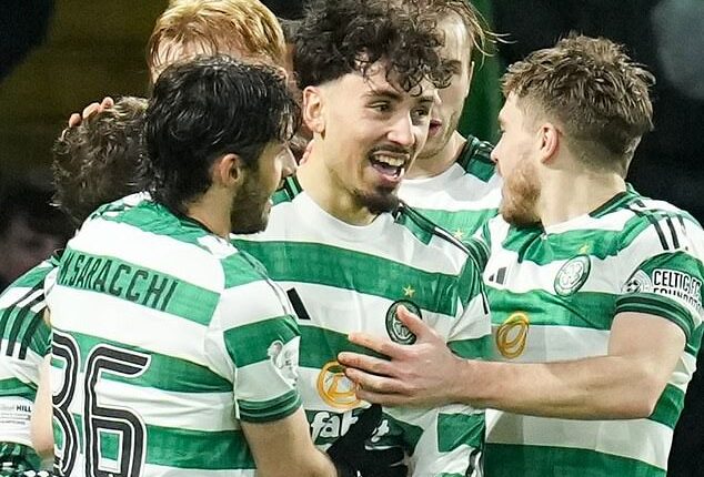 Tounekti, above centre, is congratulated by Celtic team-mates after extra-time winner