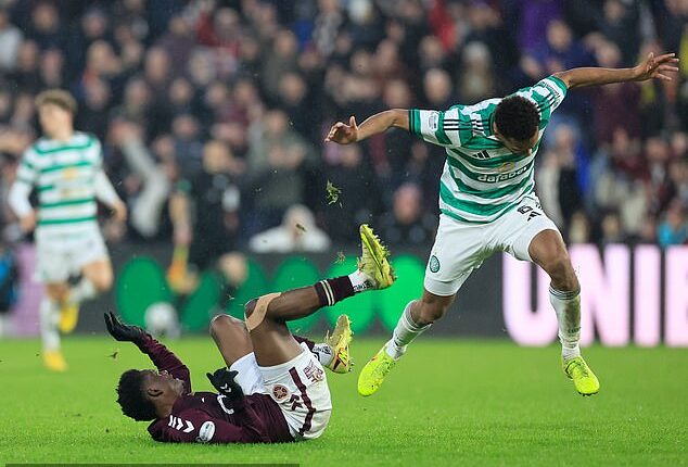Celtic defender Auston Trusty collides with Hearts striker Pierre Landry Kabore