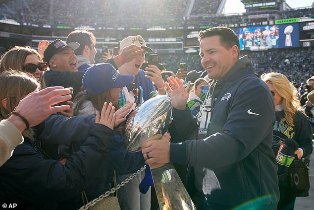 Seahawks head coach Mike Macdonald greets fans before Wednesday's parade