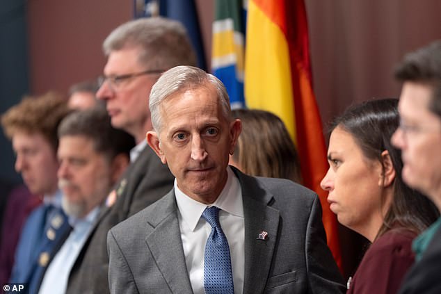 Keith Wilson (pictured center), the mayor of Portland, Oregon told Immigration and Customs Enforcement (ICE) agents to 'resign' and leave the city after he claimed peaceful protesters were tear gassed