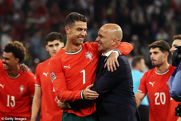 Roberto Martinez (right) insists Cristiano Ronaldo is 'very easy' to manage