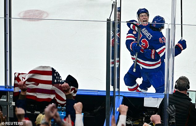 Quinn Hughes celebrates his game-winner against Sweden on Wednesday in Milan