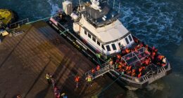 Migrants disembark from a Border Force boat at Ramsgate Port in Kent this week