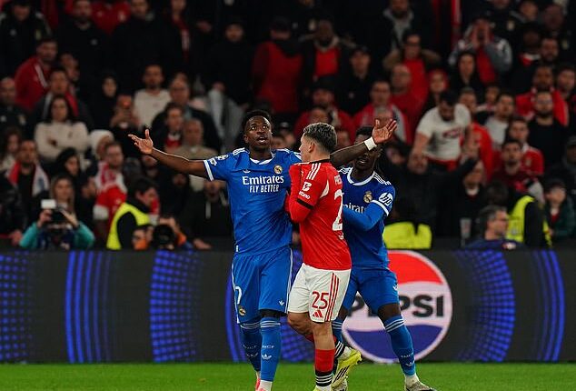 Gianluca Prestianni (right) has been handed a one-match suspension after allegations of racial abuse toward Vinicius Jr. (left)