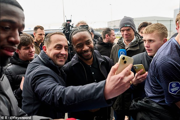 Raheem Sterling was mobbed by fans on his arrival in the Netherlands after joining Feyenoord