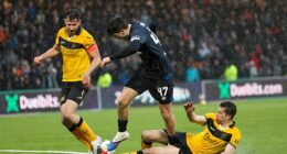 Winger Mikey Moore goes down after a challenge by Cammy Kerr that went unpunished