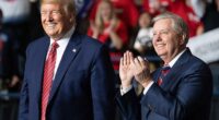 Donald Trump (L) smiles as he stands alongside US Senator Lindsey Graham (R), Republican of South Carolina, during a rally at on February 28, 2020