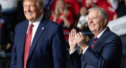Donald Trump (L) smiles as he stands alongside US Senator Lindsey Graham (R), Republican of South Carolina, during a rally at on February 28, 2020