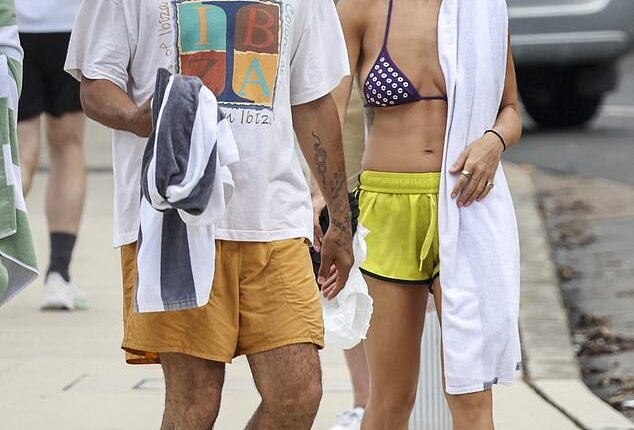 Rita Ora showed off her sensational figure as she hit the beach with her husband Taika Waititi in Australia on Monday