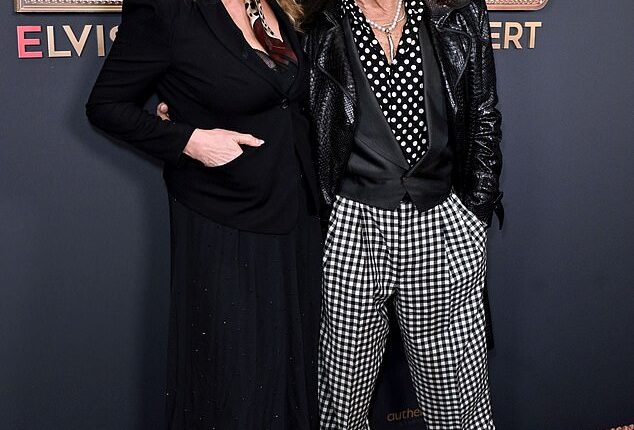 Rod Stewart and his wife Penny Lancaster put on a loved-up display as they attended the EPIC: Elvis Presley In Concert UK premiere