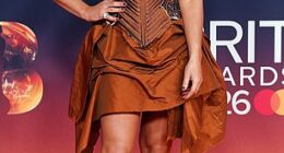 Sian Welby put on a leggy display in an autumnal corset dress as she kicked off the star-studded BRITs red carpet at the Co-op Live in Manchester on Saturday