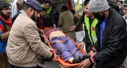 People shift an injured man to a hospital following an explosion at a mosque in Islamabad on February 6, 2026