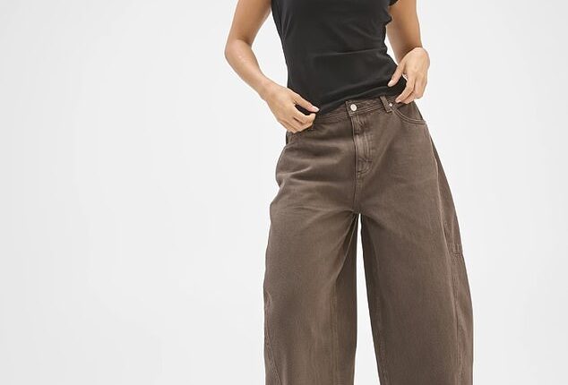 Australian shoppers are rushing to Target Australia after a $50 pair of Lily Loves Horseshoe Leg Jeans (pictured) sparked a frenzy online, with many calling them the perfect dupe for a cult $159.95 style from Levi's