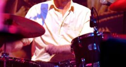 Tributes have been paid to Andrew Ranken, drummmer with the Pogues, after his death aged 72 - he is pictured here performing at the Apollo in Manchester in December 2013