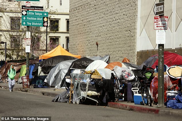Los Angeles has declined over the last 10 years, as streets have become filled with homeless people and drug addicts, making residents feel unsafe (pictured: Skid Row in March 2020)