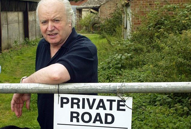 Tony Martin is pictured outside his farmhouse called Bleak House in near Wisbech, Norfolk, shortly after his release from prison in August 2003
