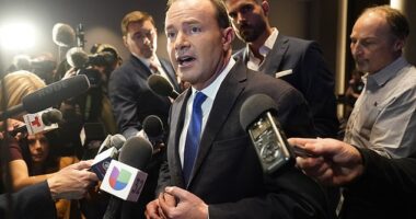 Utah Republican Mike Lee speaks to reporters in 2022 in Salt Lake City